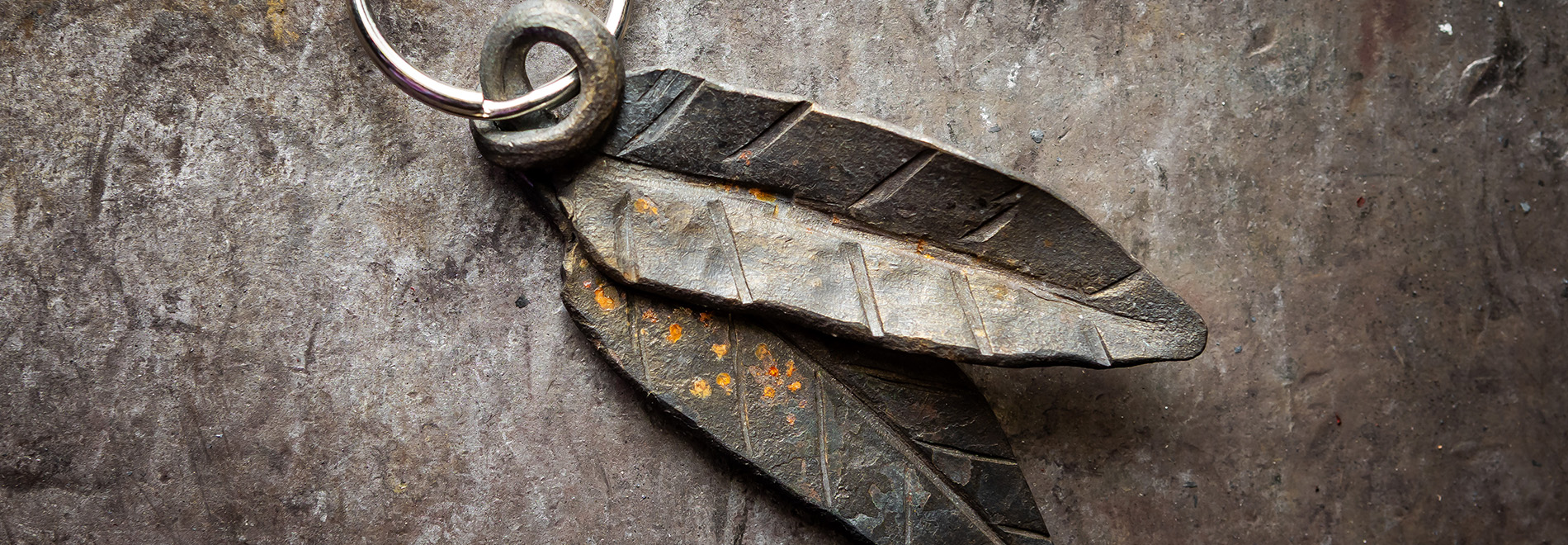 Forged metal leaf on blacksmithing anvil