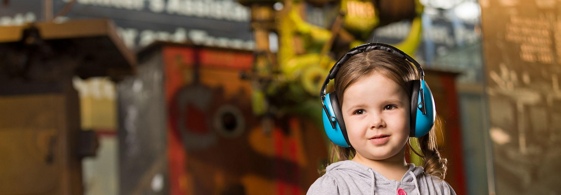 young girls with headphones at The Workshops Rail Museum sensory friendly day