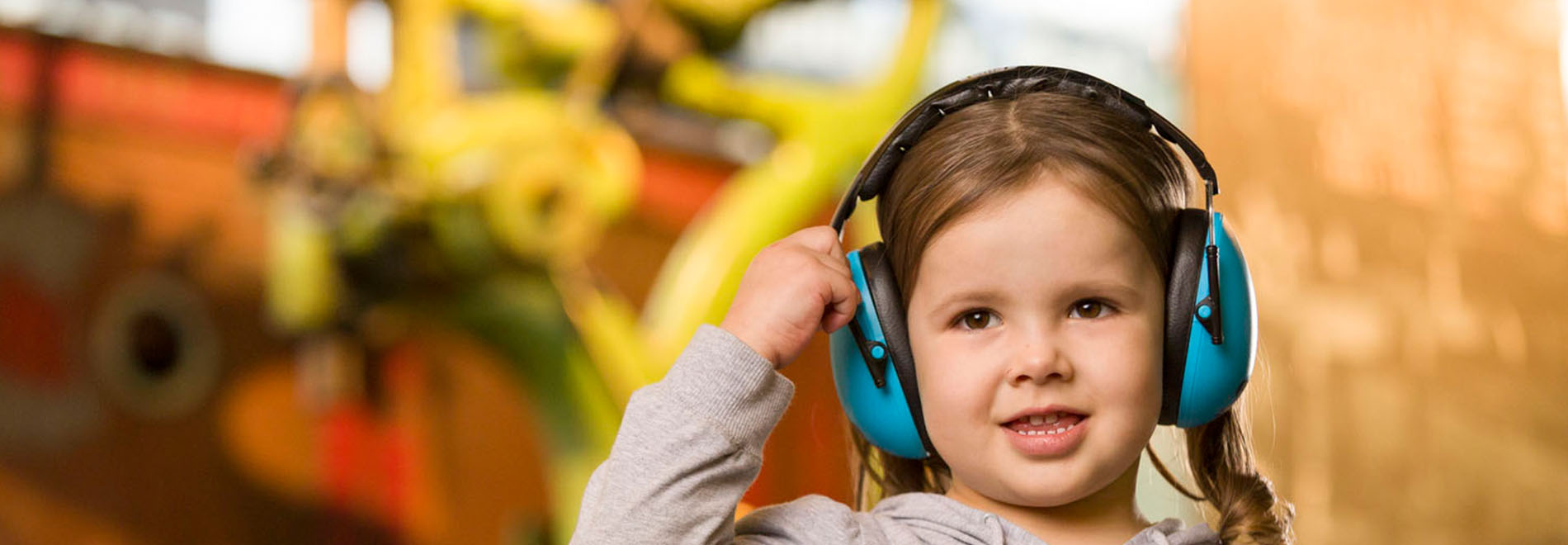 Young girl with sensory processing needs with headphones on 
